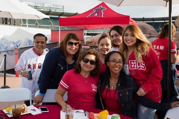 Group Smiling at Baseball Game